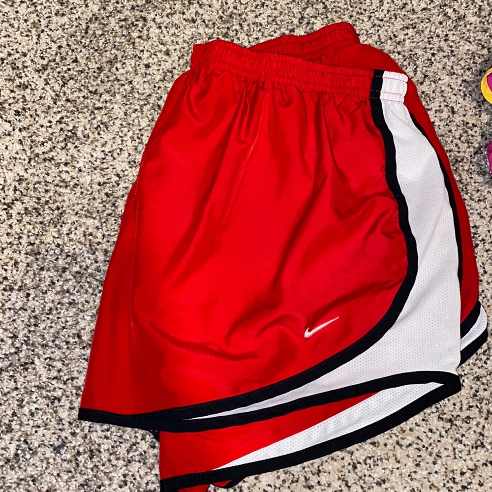 Red with black stripe Nike running shorts